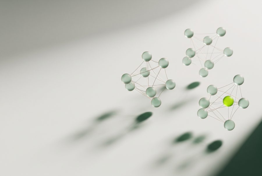 Illustration: glass spheres in three linked groups, with threads connecting the spheres in each group.
